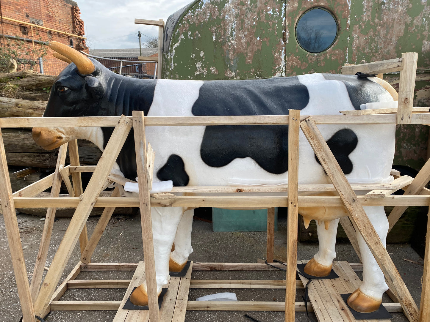 Life-size fiberglass cow statue figure
