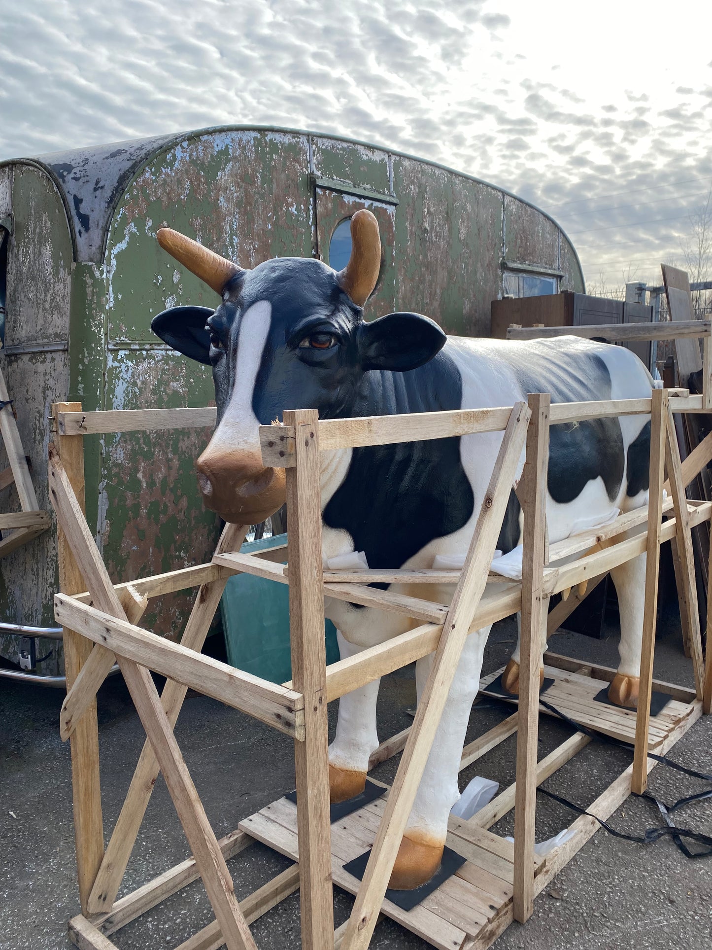 Life-size fiberglass cow statue figure