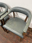 Set of 4 dining chairs with curved backs in light blue / teal leather