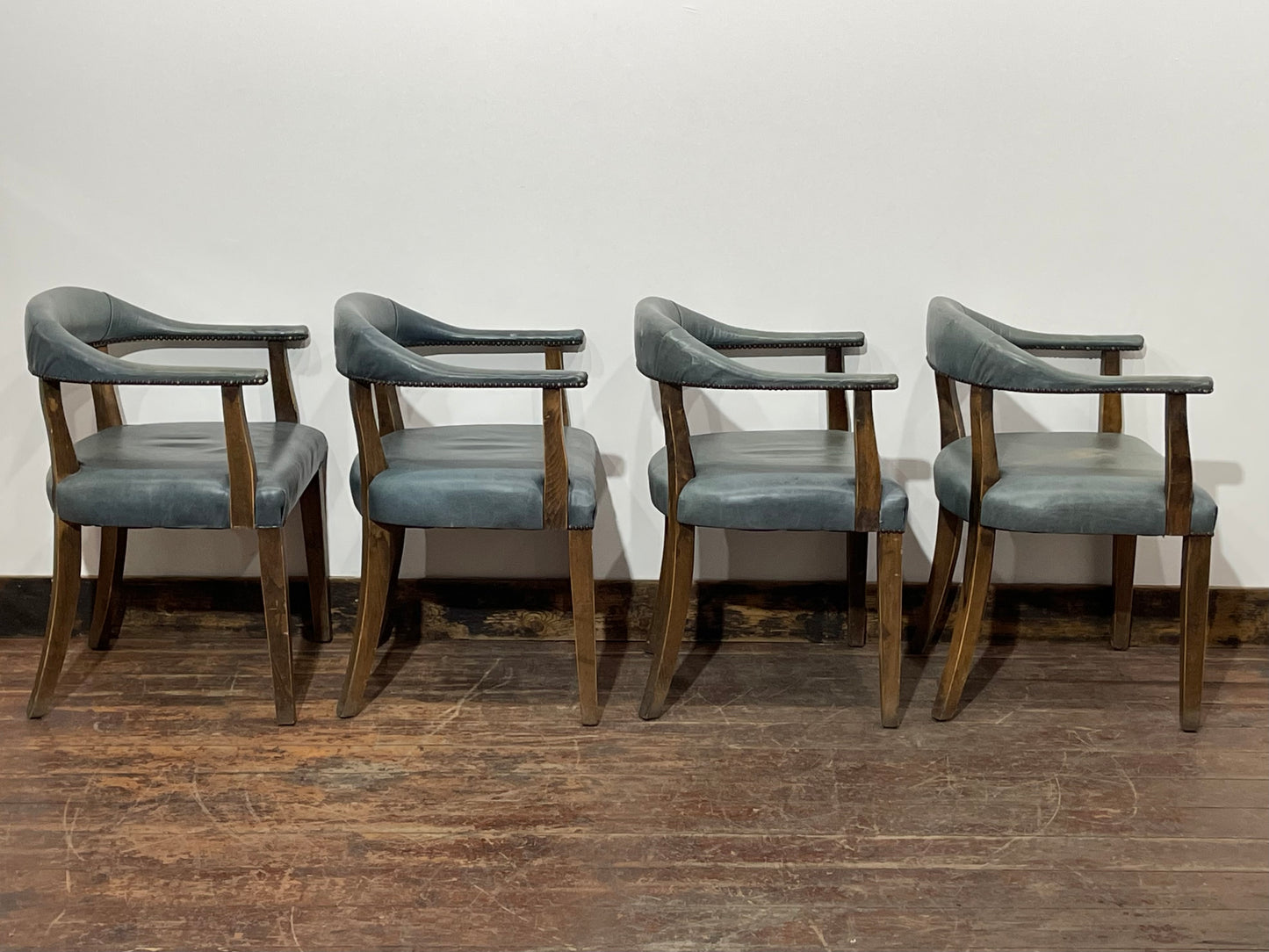 Set of 4 dining chairs with curved backs in light blue / teal leather