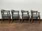 Set of 4 dining chairs with curved backs in light blue / teal leather
