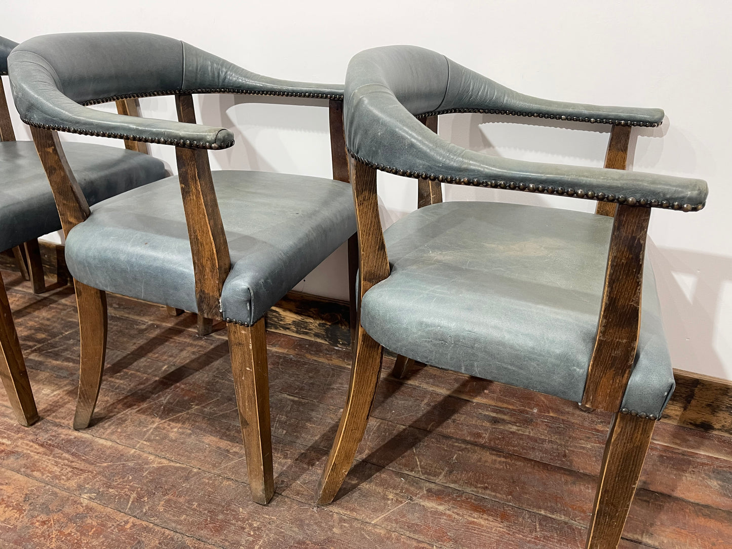 Set of 4 dining chairs with curved backs in light blue / teal leather
