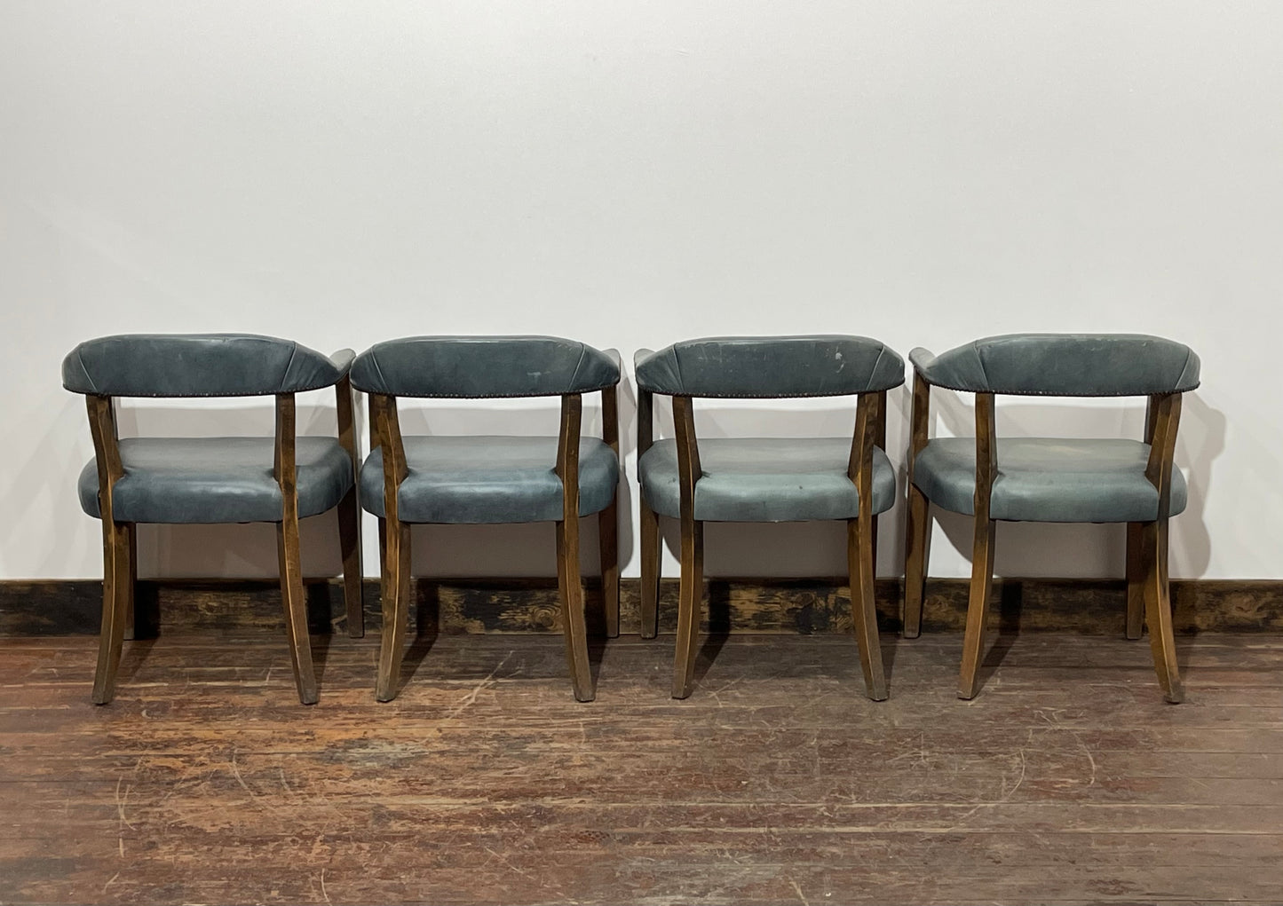 Set of 4 dining chairs with curved backs in light blue / teal leather