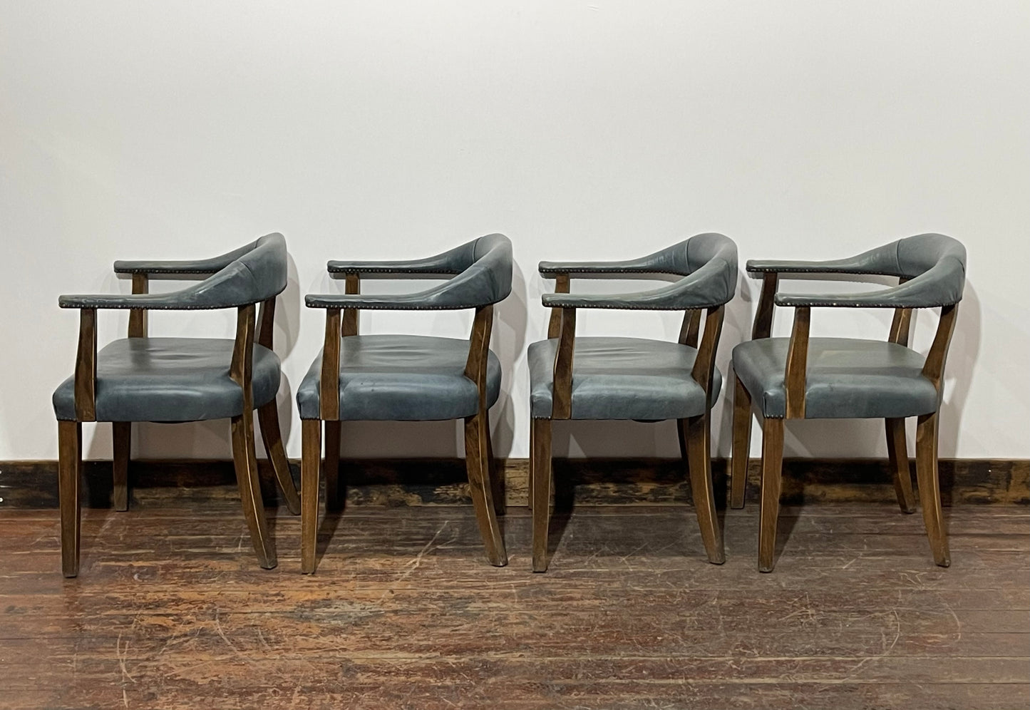 Set of 4 dining chairs with curved backs in light blue / teal leather