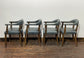 Set of 4 dining chairs with curved backs in light blue / teal leather