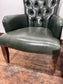 Pair of green leather armchairs with button backs