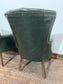 Pair of green leather armchairs with button backs