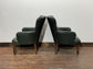 Pair of green leather armchairs with button backs