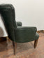 Pair of green leather armchairs with button backs