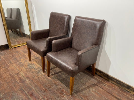 Matching pair of brown faux-leather armchairs