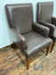 Matching pair of brown faux-leather armchairs