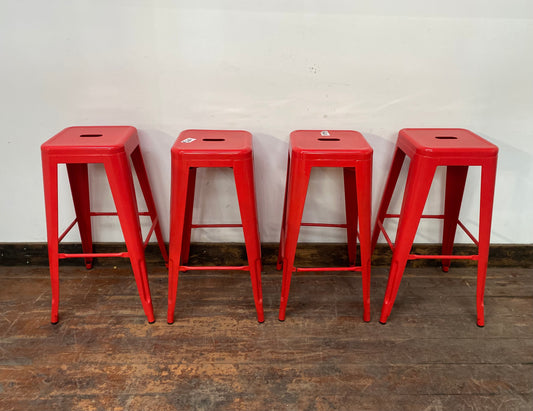 4 red metal stools