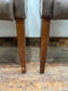Pair of leather-effect armchairs / pub chairs with check tartan backs