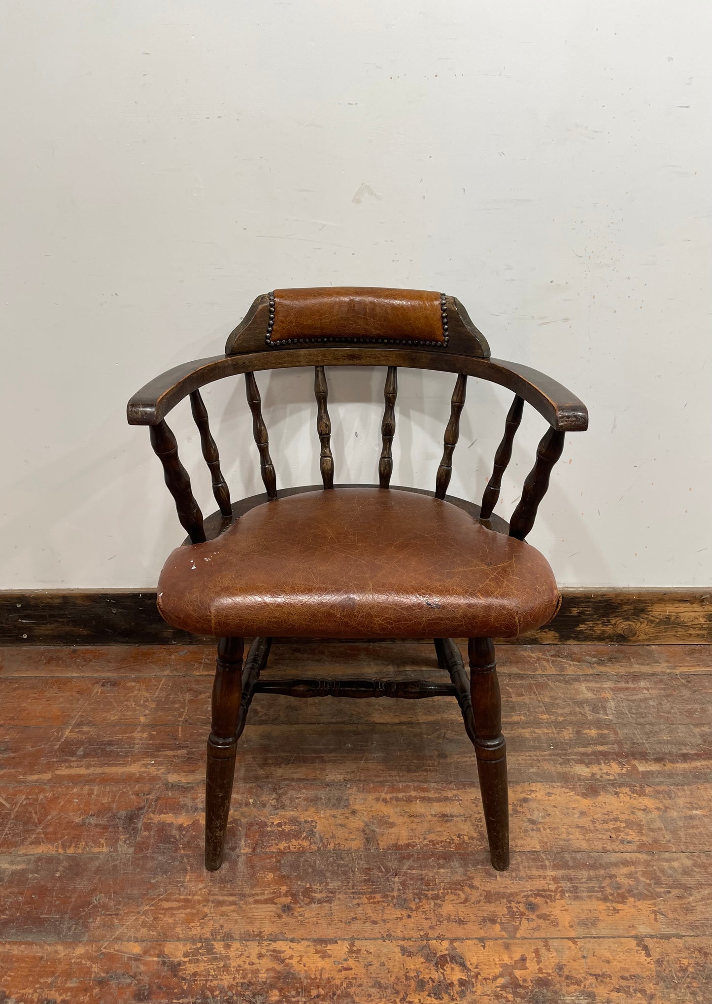 Vintage style spindle back chair with leather upholstery