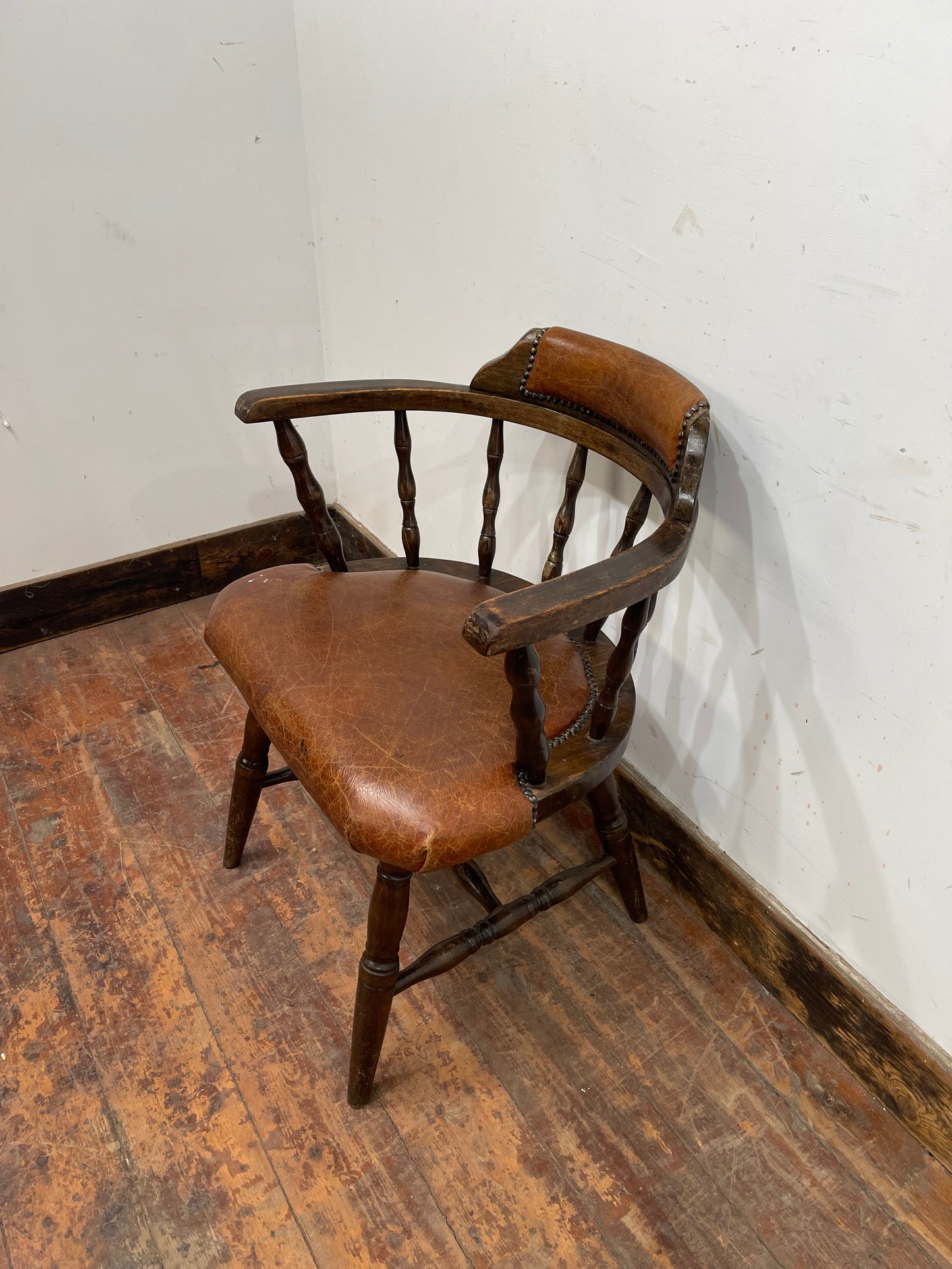 Vintage style spindle back chair with leather upholstery