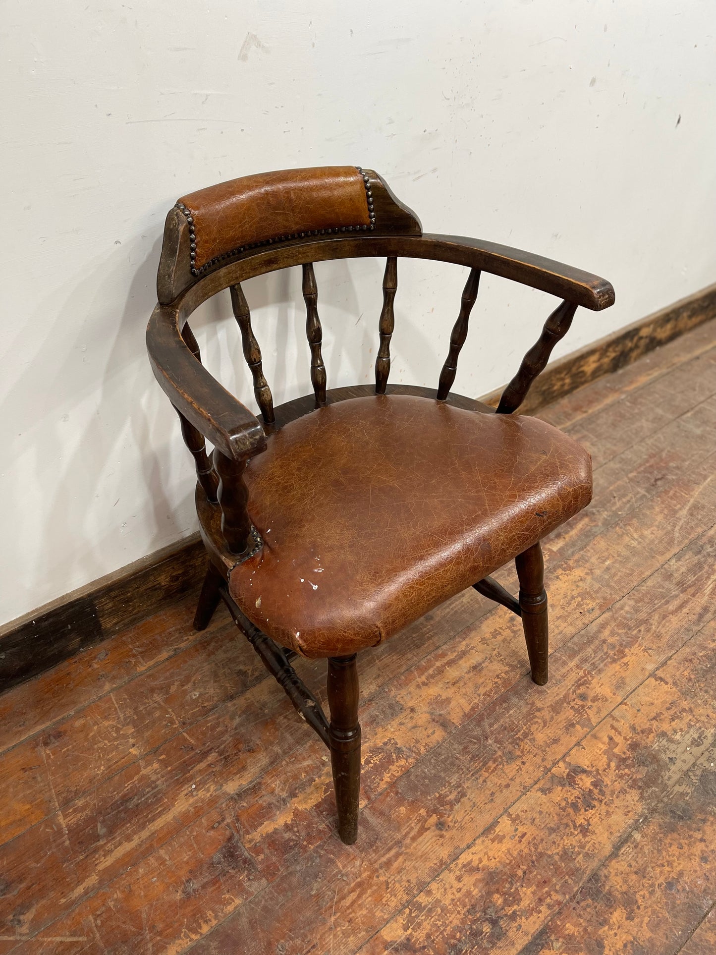 Vintage style spindle back chair with leather upholstery