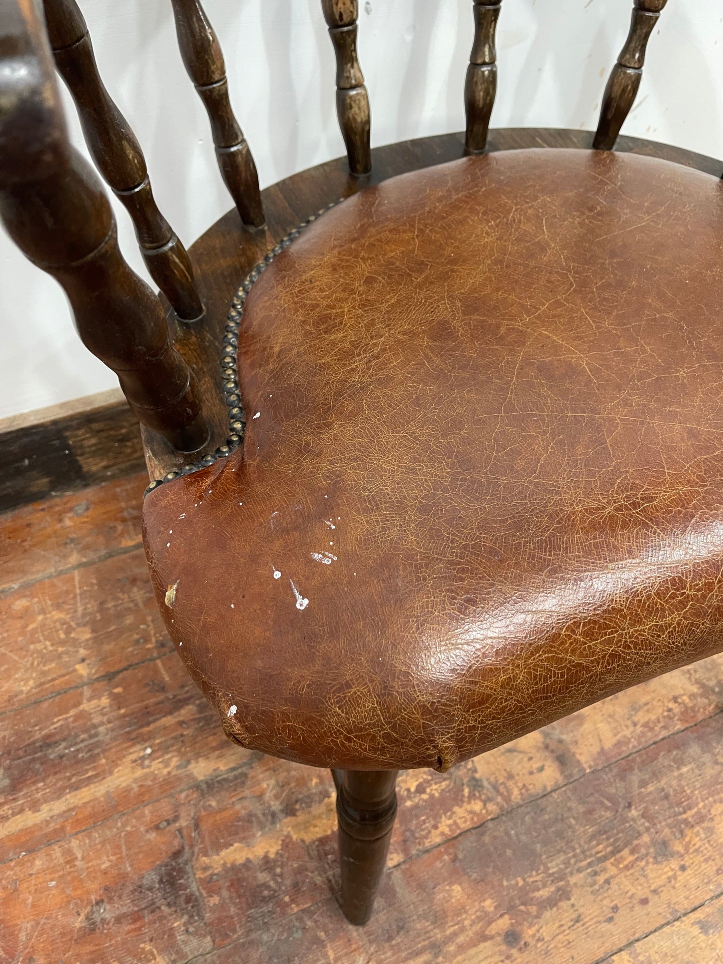Vintage style spindle back chair with leather upholstery