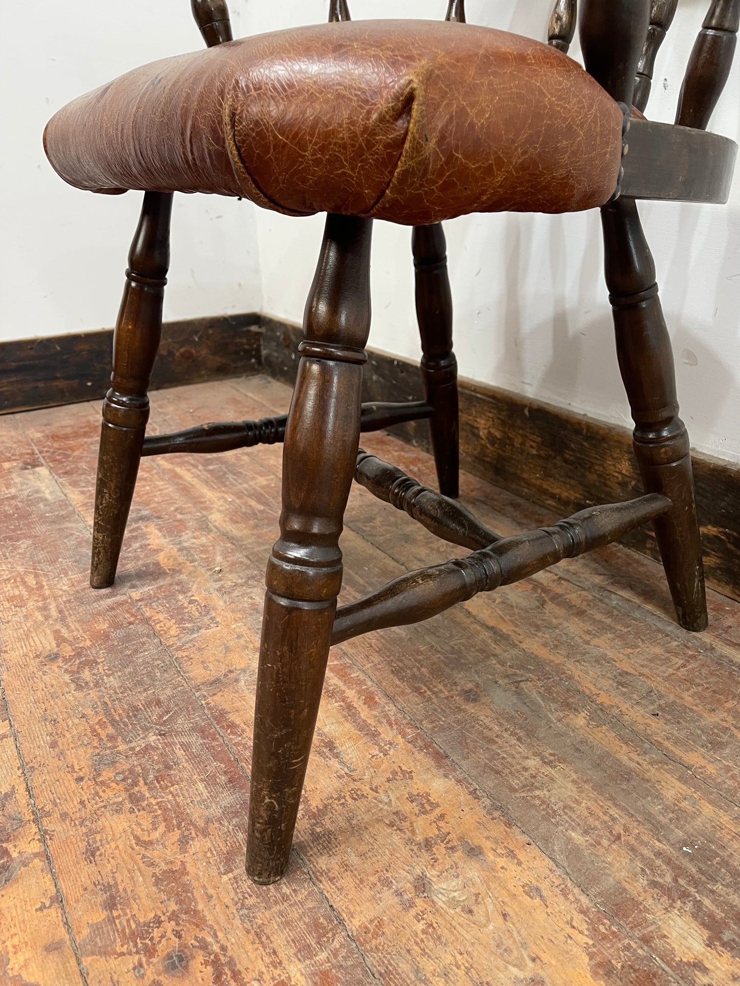 Vintage style spindle back chair with leather upholstery