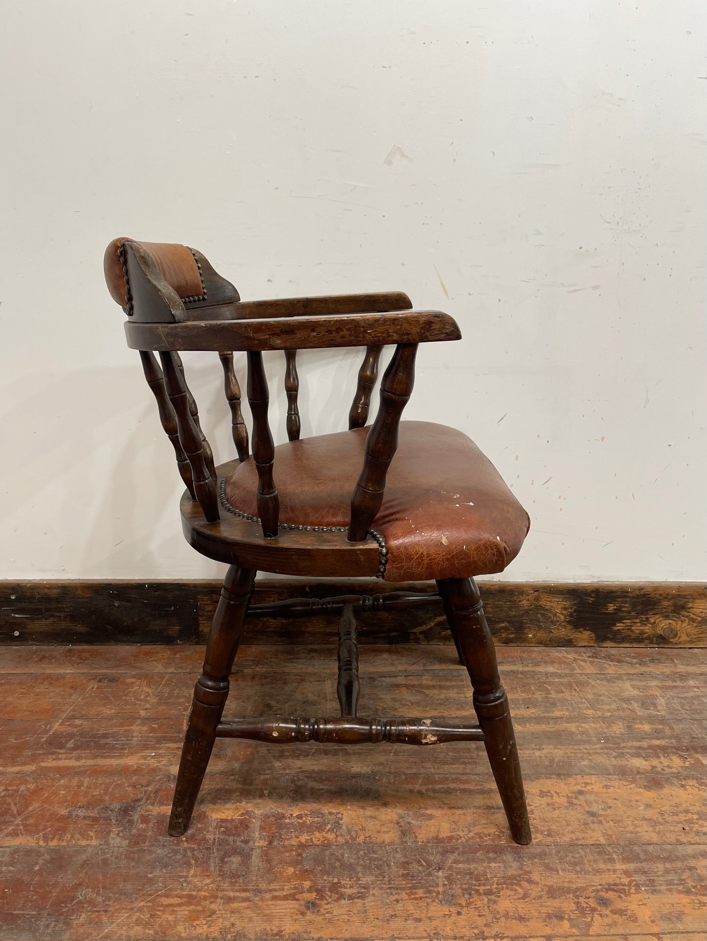 Vintage style spindle back chair with leather upholstery