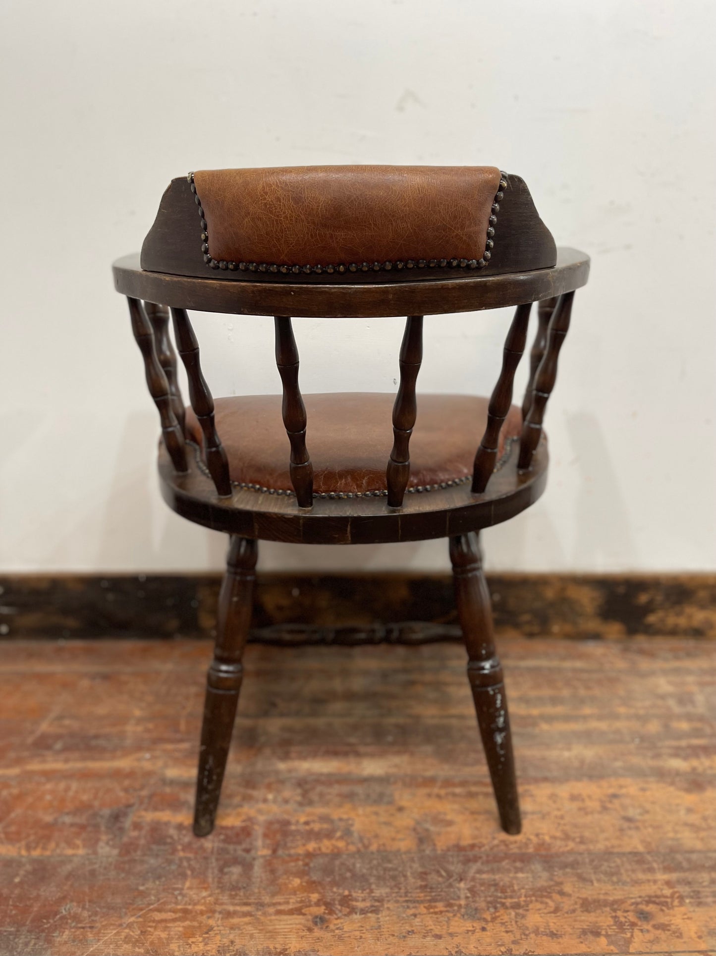 Vintage style spindle back chair with leather upholstery