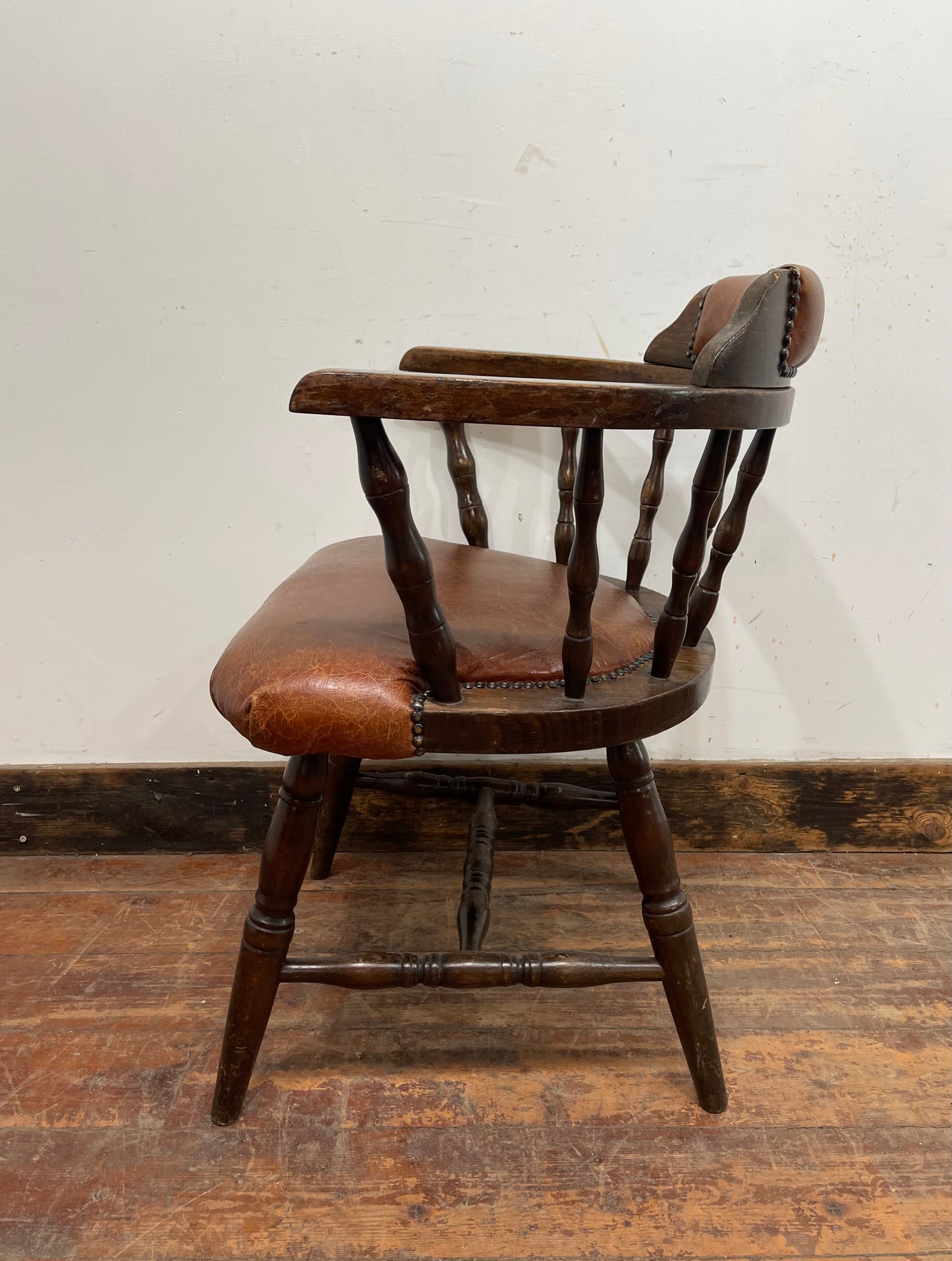 Vintage style spindle back chair with leather upholstery