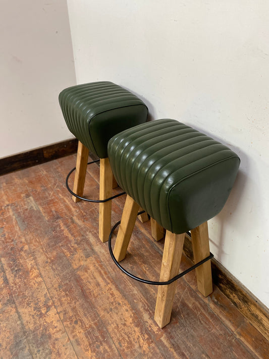Pair of green leather pommel stools