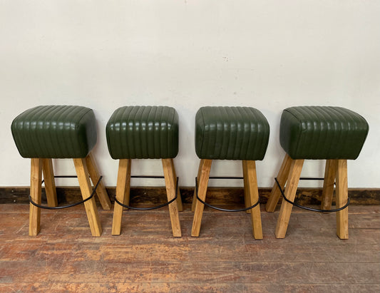 Set of 4 green leather pommel stools