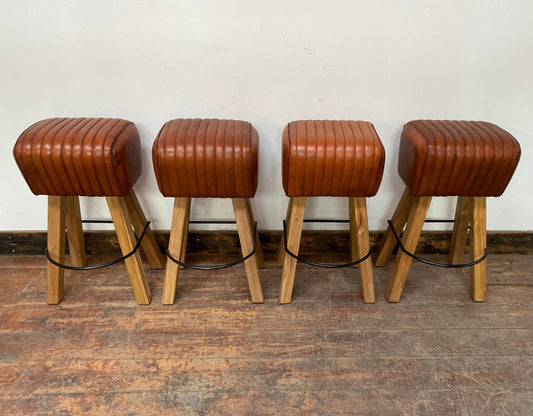Set of 4 tan leather pommel stools