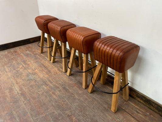 Set of 4 tan leather pommel stools