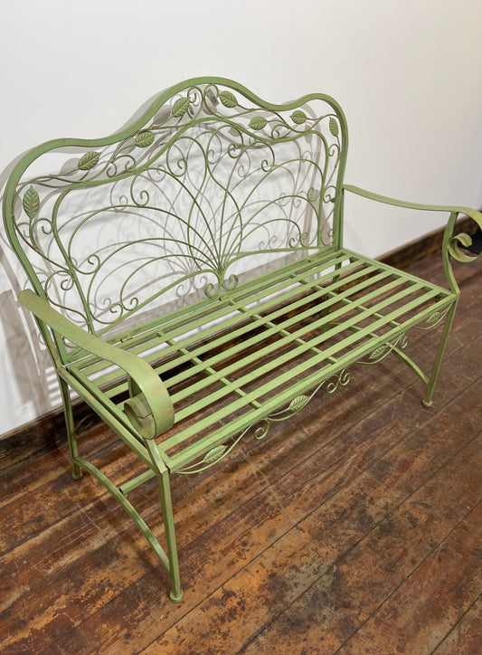 Ornate garden bench in green painted metal