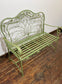 Ornate garden bench in green painted metal