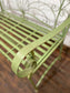 Ornate garden bench in green painted metal