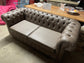 Grey Chesterfield sofa in faux-leather (ex-display)