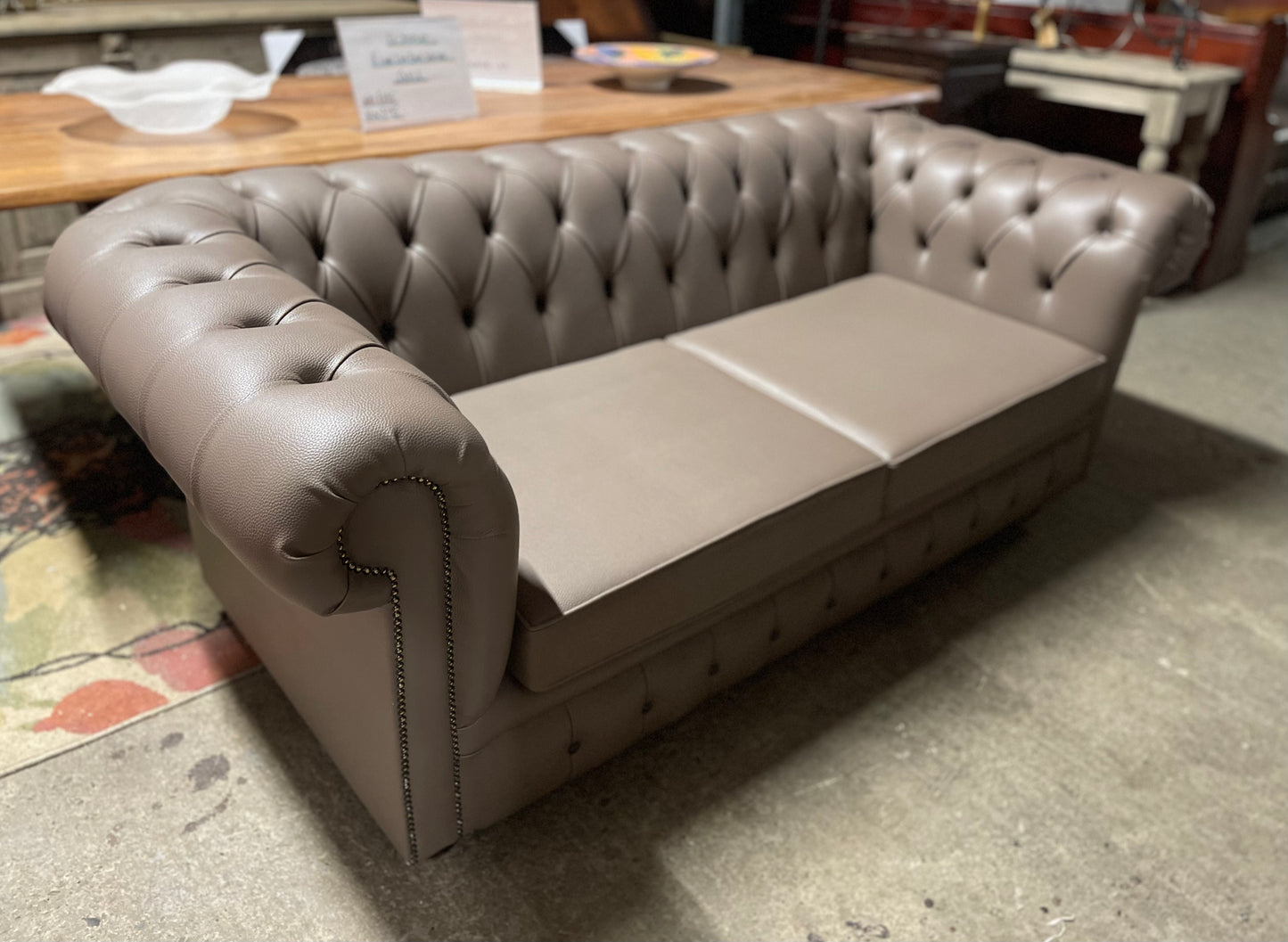 Grey Chesterfield sofa in faux-leather (ex-display)