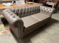 Grey Chesterfield sofa in faux-leather (ex-display)