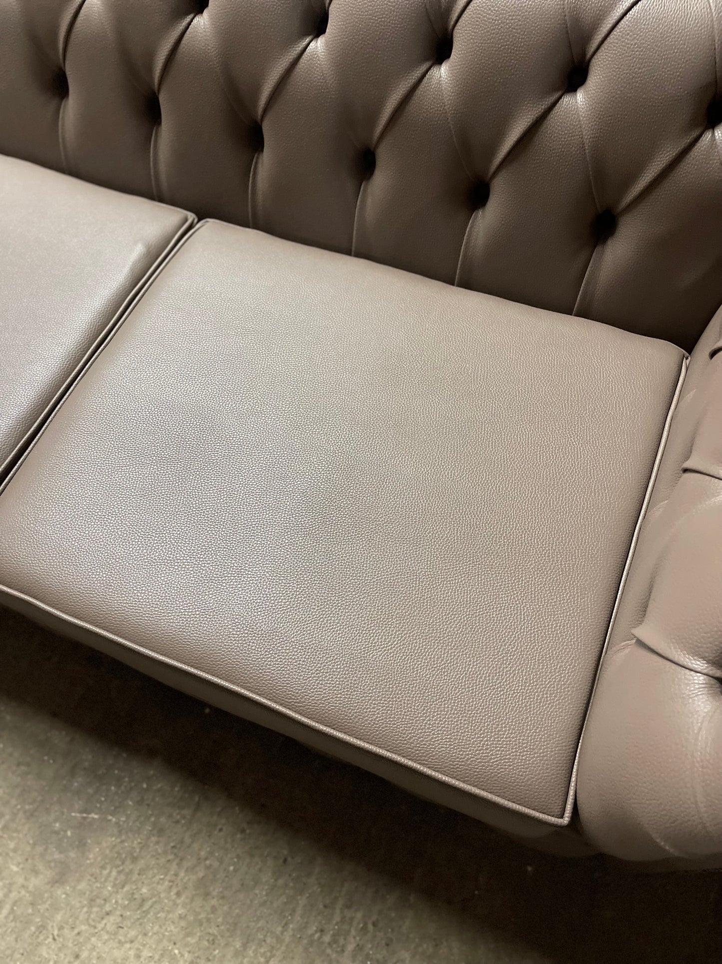 Grey Chesterfield sofa in faux-leather (ex-display)