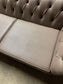 Grey Chesterfield sofa in faux-leather (ex-display)
