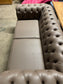 Grey Chesterfield sofa in faux-leather (ex-display)
