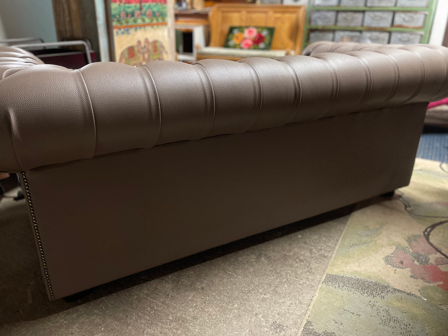 Grey Chesterfield sofa in faux-leather (ex-display)