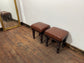 Pair of low pub stools in tan coloured faux-leather