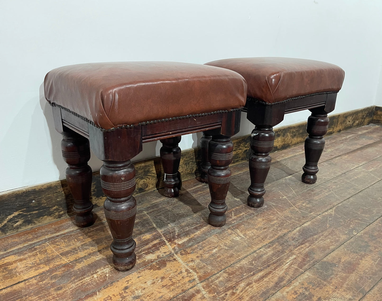 Pair of low pub stools in tan coloured faux-leather