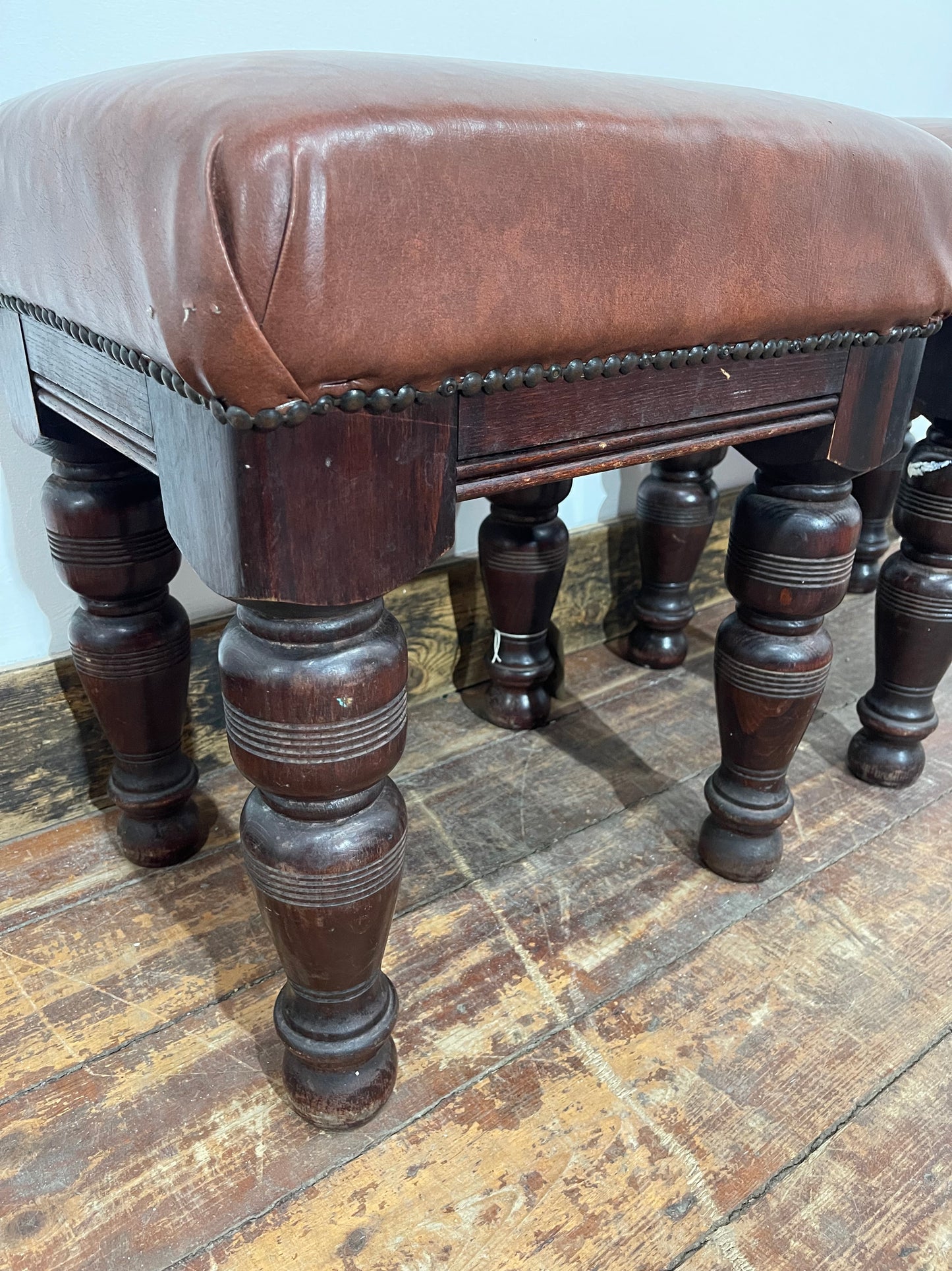 Pair of low pub stools in tan coloured faux-leather