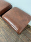 Pair of low pub stools in tan coloured faux-leather