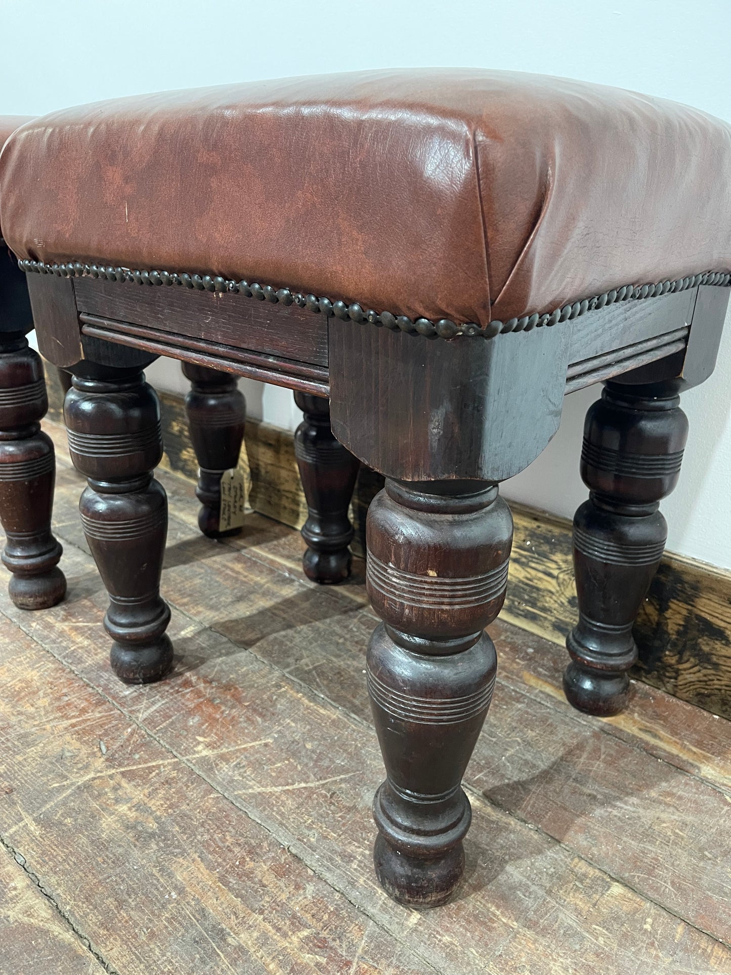 Pair of low pub stools in tan coloured faux-leather