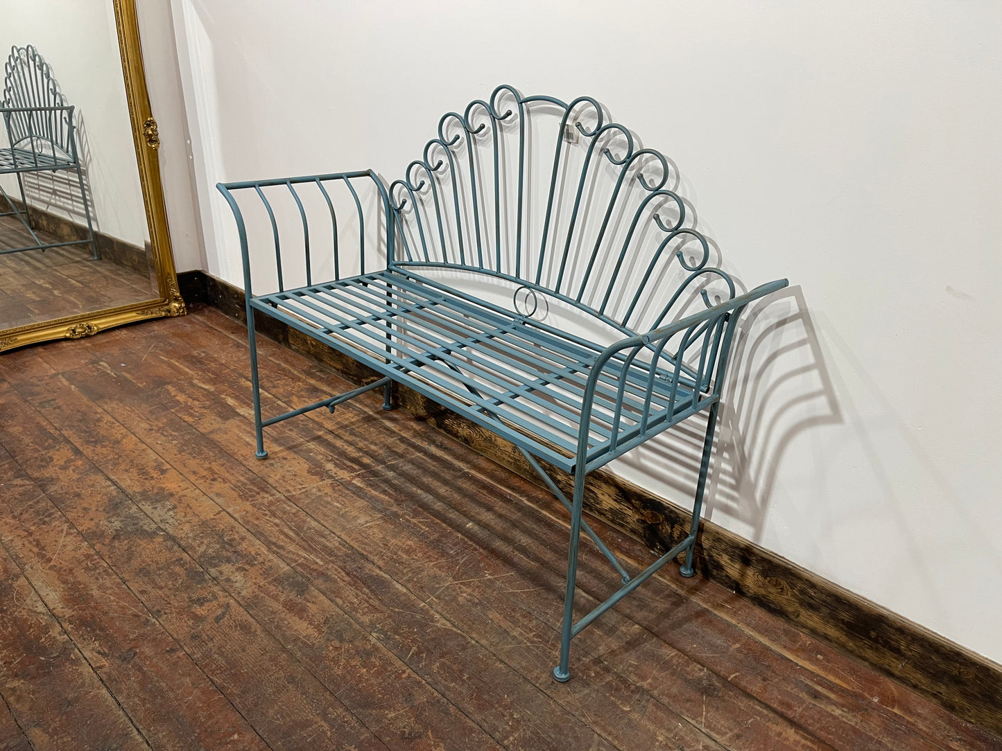 Pretty metal garden bench in light blue