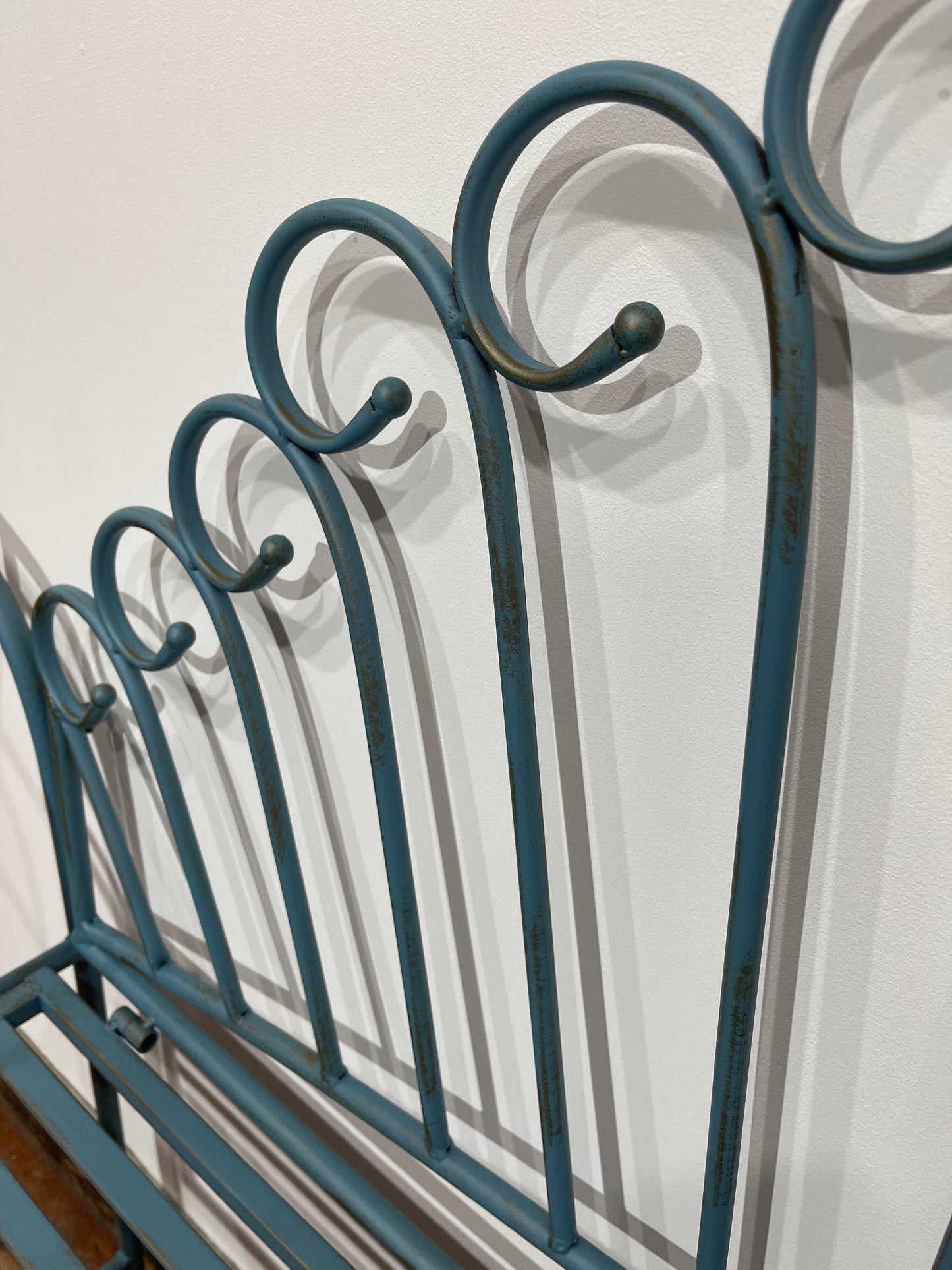 Pretty metal garden bench in light blue
