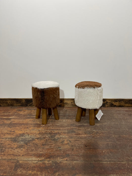 Pair of low cow hide stools