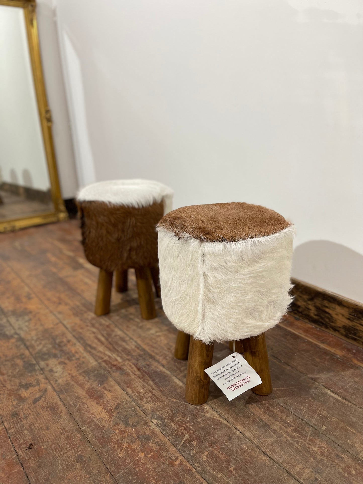 Pair of low cow hide stools
