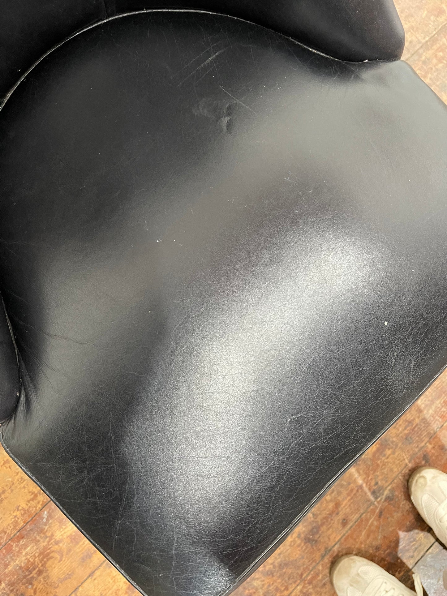 Pair of high back black studded chairs