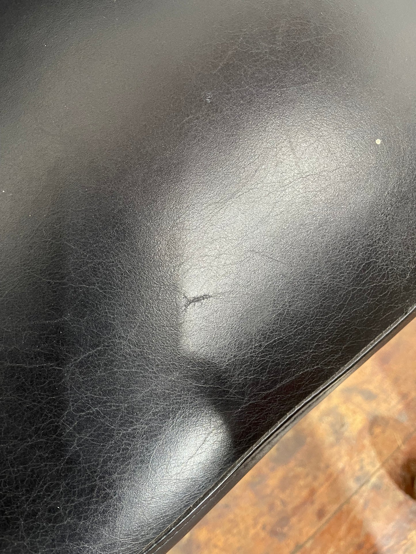 Pair of high back black studded chairs